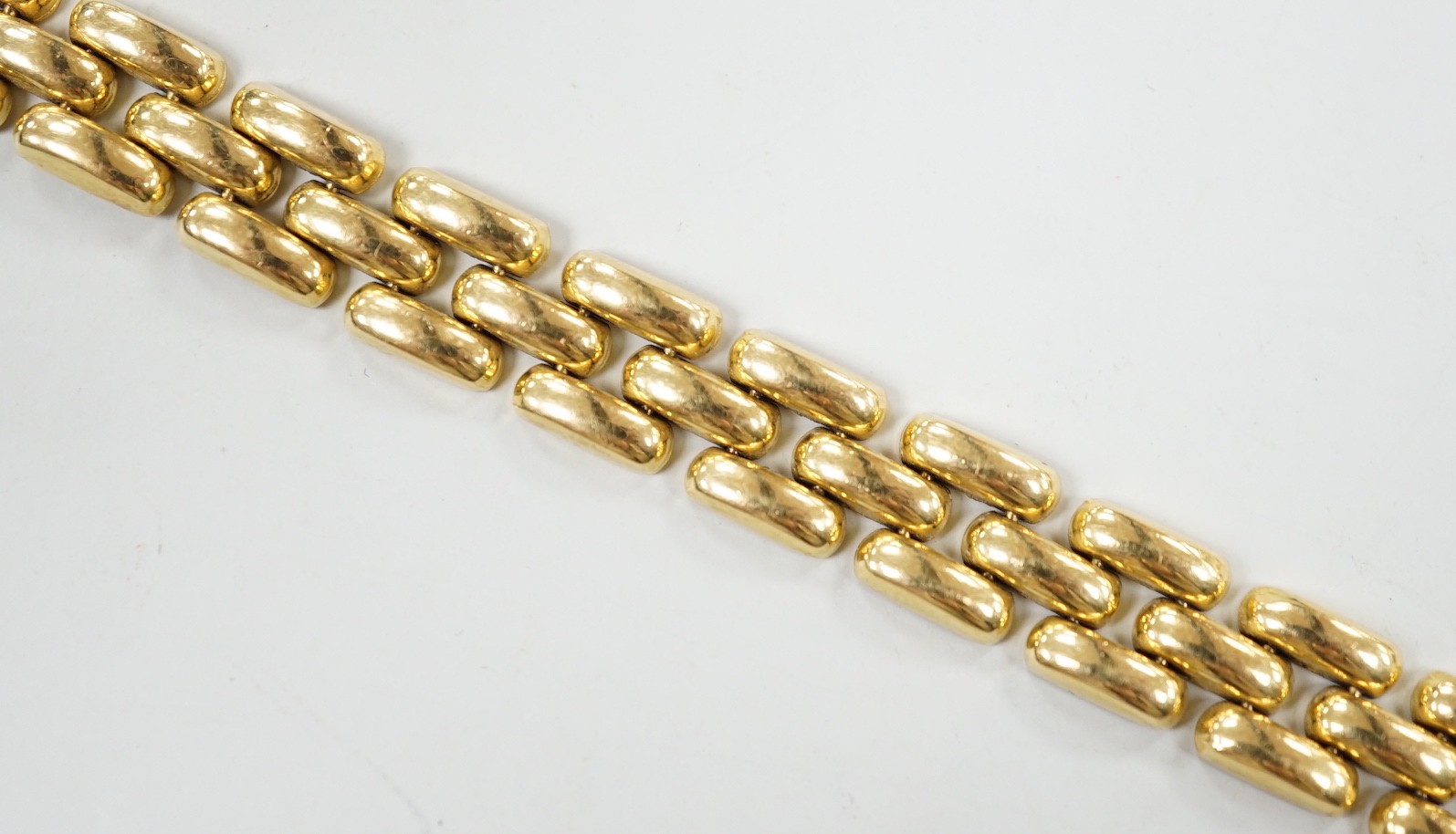 A modern 18ct gold brick link bracelet, 19cm, 21.2 grams.